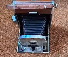 2 POLAROID LAND CAMERAS WITH CASES AND ACCESSORIES